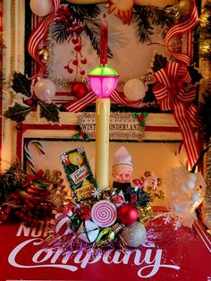 a christmas display with candy, candies and candles