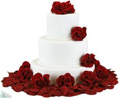 a three tiered white cake with red flowers on top