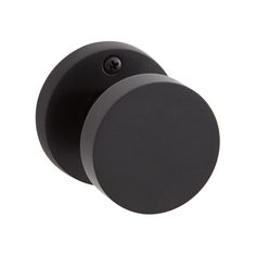 two black round knobs on a white background