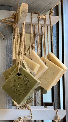 soap bars hanging from rope on the wall