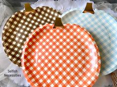 three paper plates with different designs on them