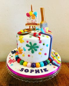 a birthday cake decorated with colorful candies and decorations