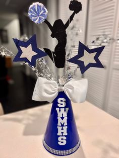 a party hat with cheerleader decorations on it and stars around the top that says smm's