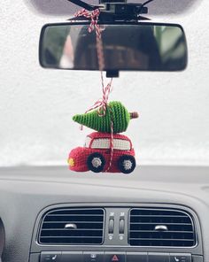 a car with a christmas tree hanging from the dash board