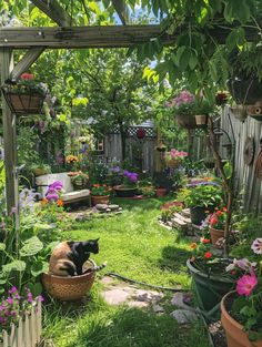 a dog laying in a basket on the ground next to some plants and flowers outside