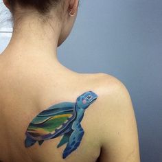 a woman with a colorful tattoo on her back