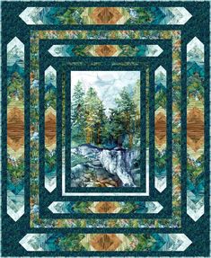 a quilt with a waterfall and trees in the background