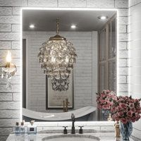 a bathroom with a sink, mirror and chandelier in the middle of it