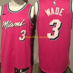 a pink jersey with the number 3 on it is displayed in front of a mannequin