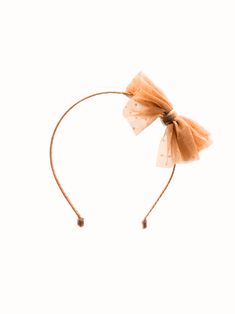 Feeling like a princess on special occasions has never been easier with our Rosalie Tulle Bow Headband. Made with delicate tulle and luxurious velvet details, this headband adds elegance to any look. Make a statement and feel confident with this must-have accessory. lightweight metal headband wrapped in peach blush tulle with gold velvet details. The headband measures approximately 5.0 x 6.0 inches. * Due to the nature of our handmade bows each bow may look slightly different. This hair accessor Baby Bow Clips, Tulle Bow, Headband Wrap, Metal Headband, Tulle Bows, Peach Blush, Metal Headbands, Gold Velvet, Large Bow