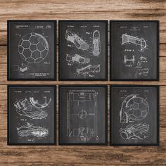 four framed drawings of soccer equipment on a wooden table with a blackboard in the background