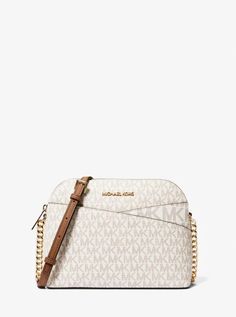 This crossbody bag boasts signature appeal in logo-print canvas that’s accented with top-stitch detailing. Rendered in a structured dome shape, it features an adjustable chain-trimmed strap and a convenient back slip pocket..• Crossbody bag.• Logo-print canvas.• 89.4% coated canvas/9.6% polyester /1% polyurethane.• Gold-tone hardware.• 8.5”W X 6.75”H X 3.5”D.• Exterior details: back slip pocket.• Interior details: back zip pocket, front slip pocket.• Lining: 100% polyester.• Zip fastening.• Dust Michael Kors Mercer, Japanese Store, Michael Kors Shoulder Bag, Media Logo, Michael Kors Crossbody, Bags Logo, Womens Crossbody Bag, Stylish Bag, Michael Kors Jet Set