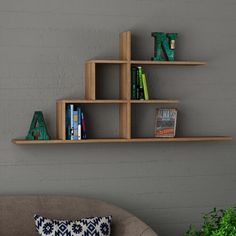 three wooden shelves on the wall above a couch