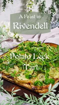 a pizza sitting on top of a wooden cutting board next to green leaves and flowers