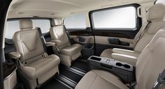 the interior of a vehicle with beige leather seats