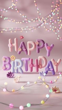 the words happy birthday are spelled out with flowers and butterflies in front of a pink background