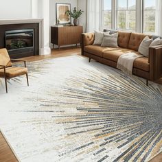 a living room filled with furniture and a large rug on the floor in front of a fire place