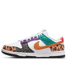 Step into the wild side with the Nike Wmns Dunk Low SE 'Safari Mix'! This one-of-a-kind shoe blends exotic textures and prints for a truly unique look. Crafted from a bright white leather base, the upper is designed with vivid Durabuck leopard patterns, safari prints, faux-horsehair accents and blue suede detailing for an animalistic touch. The vintage Nike woven tongue labels give a subtle but classic nod to street style. Turn heads on your next night out or add some flair to your everyday wardrobe with this wild design from Nike! (SNKR/Skate/Light/Low Top/Women's/Non-Slip/Multicolor) Wmns Dunk Low, Wild Design, Multicolor Shoes, Safari Print, Into The Wild, Girly Shoes, Leopard Pattern, Nike Dunk Low, Nike Sneakers