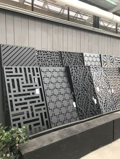 an assortment of decorative metal panels on display