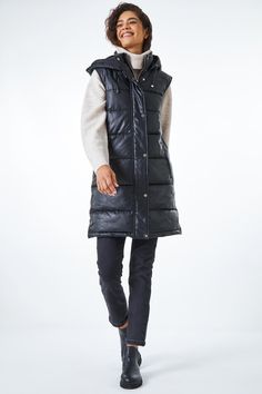 Faux Leather Longline Quilted Gilet from Roman. Sleek and stylish, this leather look, quilted, longline gilet is a must-have for the colder months ahead. Finished with a funnel neck and hood, this fully lined gilet features a fully zipped front, functional zip pockets, and an outer storm flap for extra protection against the elements. A great layering piece; pair with jeans and a jumper for the ultimate Autumn outfit. Quilted Gilet, Oasis Fashion, Autumn Outfit, Women's Coats & Jackets, Funnel Neck, Fashion Face, Layering Pieces, Long A Line, Funnel