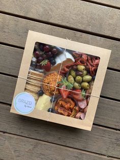 a puzzle with an image of different foods in it on top of a wooden table