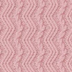 a pink knitted background with wavy lines