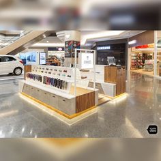 a car is parked in front of the store's checkout counter and display area