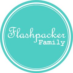 the flashpacker family logo in white on a teal blue circle with the words flashpacker family