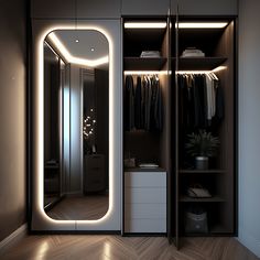 the closet is lit up with lights and clothes hanging on it's shelves, along with an illuminated mirror