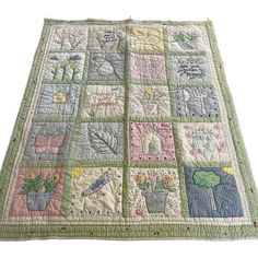 a quilted table runner with many different designs on the front and back side,