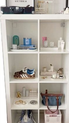 a white book shelf filled with lots of items