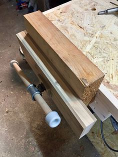 a workbench with wood and tools on it