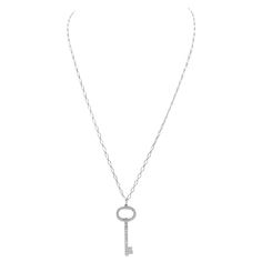 Finely crafted in platinum with diamonds covering the entire key, with original chain. Signed Tiffany & Co. Tiffany And Co Diamond, Tiffany Necklace, Key Necklace, Tiffany And Co, Oval Diamond, Tiffany & Co., Platinum, Silver Necklace, Diamonds