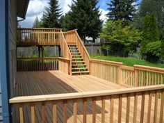 a wooden deck with stairs leading up to it