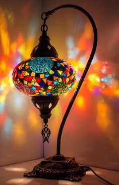 a multicolored lamp on a table with the words multicolor 1 above it