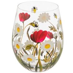 a glass with flowers and bees painted on it