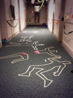 a long hallway with chalk drawings on the floor