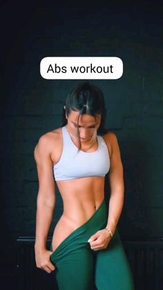 a woman in tight green pants with an ad above her head that says abs workout