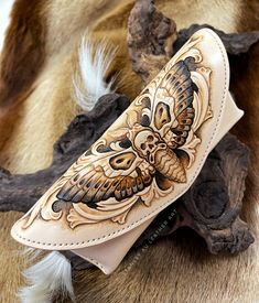 a leather case with an owl design on it