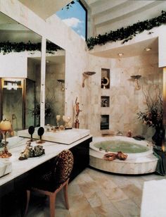 a bathroom with a tub, sink and mirror