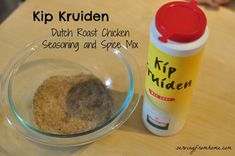 a glass bowl filled with spices next to a bottle of krip kruiden