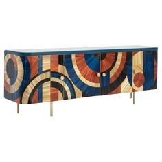 an art deco sideboard with colorful circles painted on it