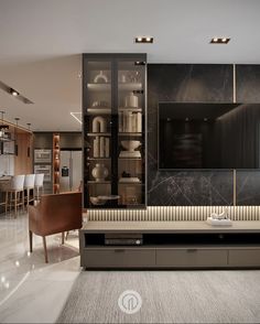 a living room filled with furniture and a flat screen tv mounted on a wall next to a dining room table