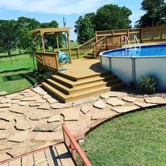 an above ground pool with steps leading up to it