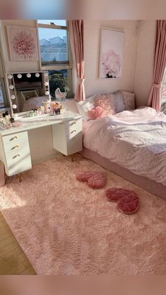 a bedroom with pink carpet and white furniture