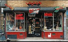 a store front with lots of guitars on display