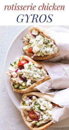 three chicken gyros are on a white plate