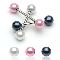 three different colored pearls are attached to an ear pin