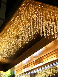 a building with lights hanging from it's ceiling