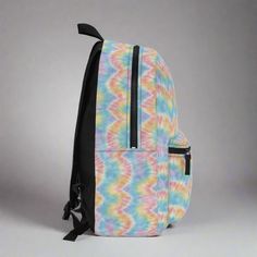 Make a bold statement with our Pastel Tie Dye Backpack, a vibrant accessory that adds a splash of color to your daily adventures! Perfect for school, travel, or simply expressing your unique style, this backpack is both stylish and practical. Stand out from the crowd and let your personality shine with this fun and eye-catching accessory! This bag is made from spun polyester and weights 1.3 lbs, just enough to be light, strong and long-lasting. .: 100% polyester.: Lightweight and waterproof.: Ad Tie Dye Backpack, Pastel Tie Dye, Color Splash, Unique Style, Tie Dye, Long Lasting, Dye, Pastel, Backpacks